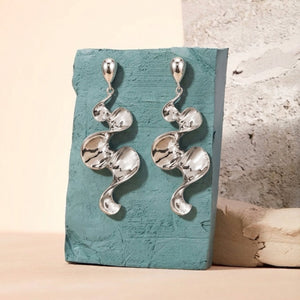 Long sculptural molten wave ribbon drop earrings in silver and gold – anti-tarnish Korean jewellery by Sajna Sawarnaa
