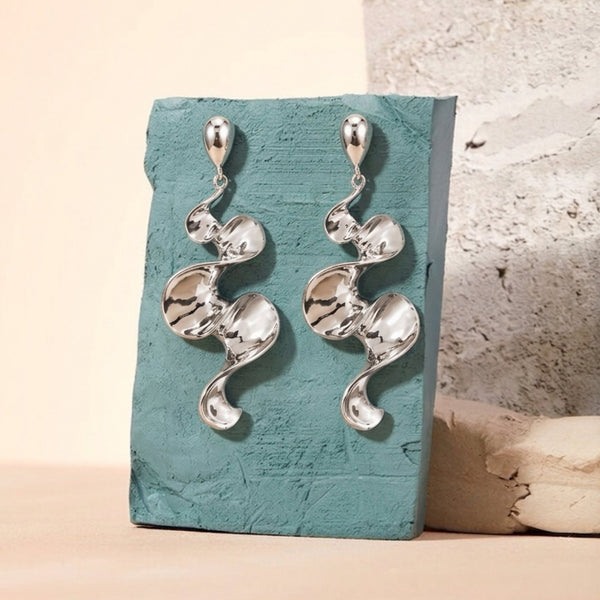 Long sculptural molten wave ribbon drop earrings in silver and gold – anti-tarnish Korean jewellery by Sajna Sawarnaa
