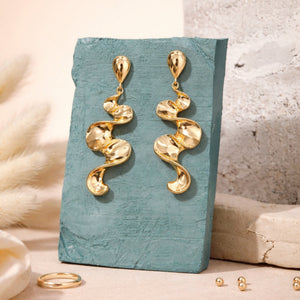 Long sculptural molten wave ribbon drop earrings in silver and gold – anti-tarnish Korean jewellery by Sajna Sawarnaa
