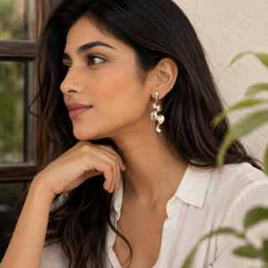 Long sculptural molten wave ribbon drop earrings in silver and gold – anti-tarnish Korean jewellery by Sajna Sawarnaa
