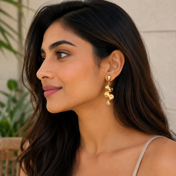 Long sculptural molten wave ribbon drop earrings in silver and gold – anti-tarnish Korean jewellery by Sajna Sawarnaa
