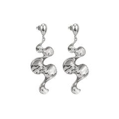Long sculptural molten wave ribbon drop earrings in silver and gold – anti-tarnish Korean jewellery by Sajna Sawarnaa