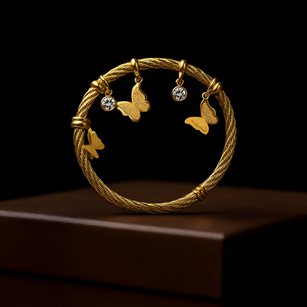 Gold butterfly charm bracelet for women by Sajna Sawarnaa, elegant designer bangle with intricate butterfly detail.