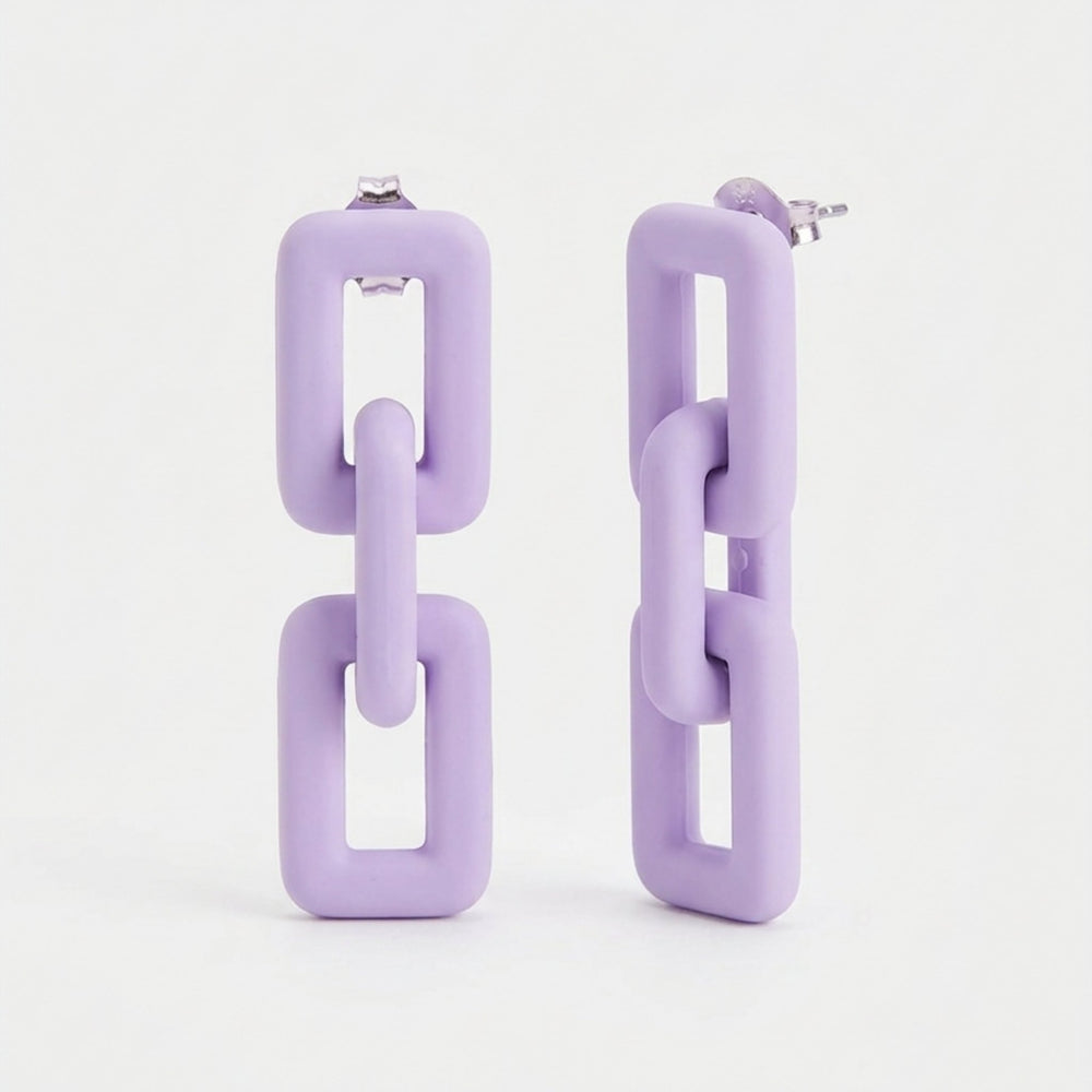 Woman wearing lavender pastel geometric chain-link statement earrings with Korean-inspired modern minimal design