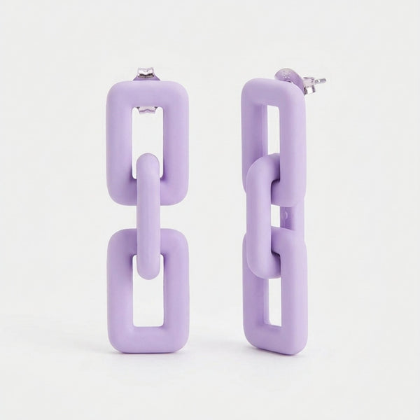 Woman wearing lavender pastel geometric chain-link statement earrings with Korean-inspired modern minimal design
