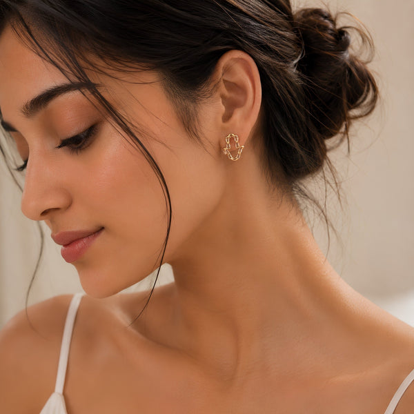 Open outline Hamsa hand stud earrings with sparkling white stone border in gold – anti-tarnish Korean jewellery by Sajna Sawarnaa
