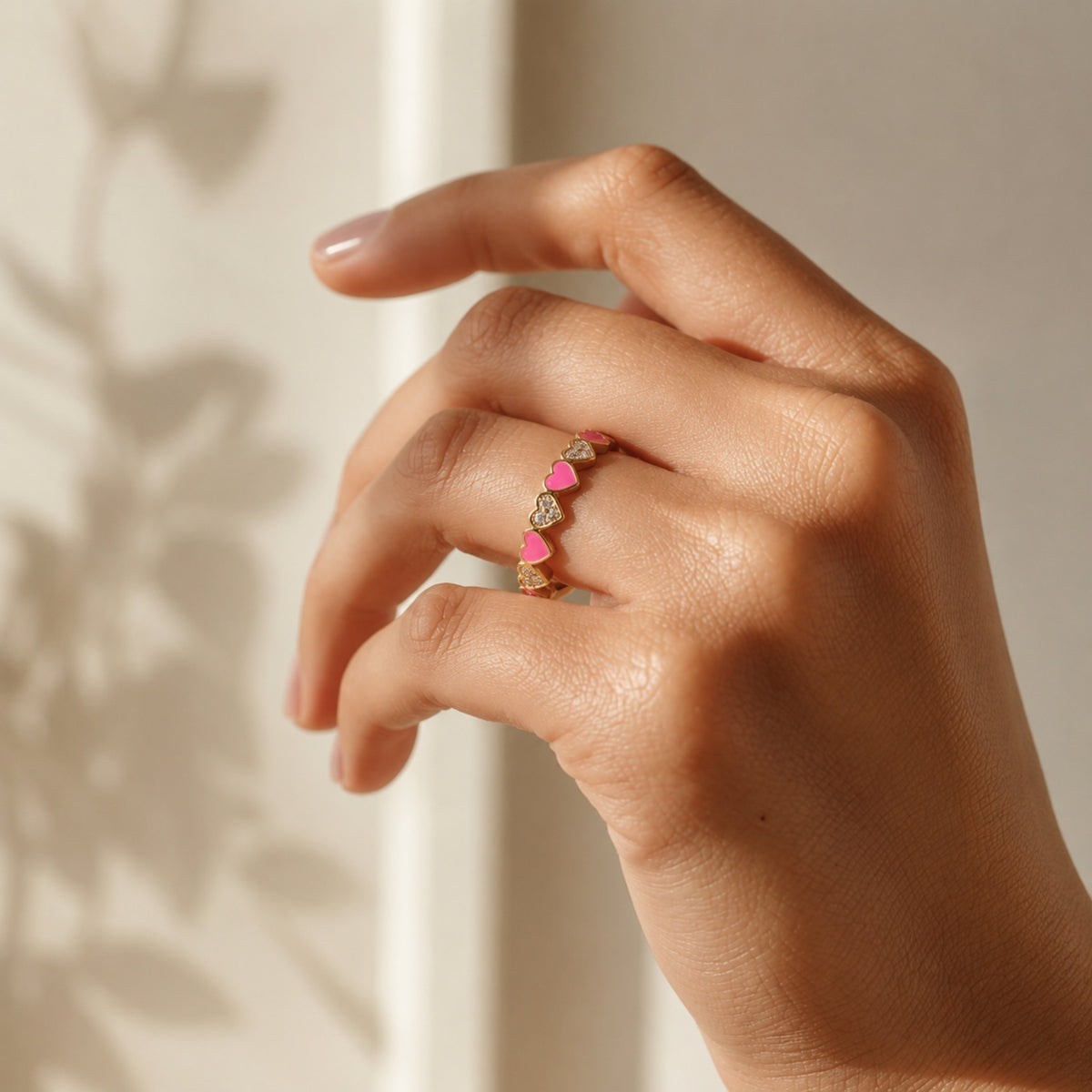 Pink heart crystal adjustable ring worn on hand