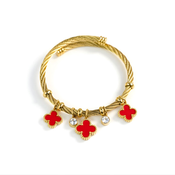 Red charm bracelet with gold finish featuring lucky clover charms by Sajna Sawarnaa, stylish jewelry accessory.