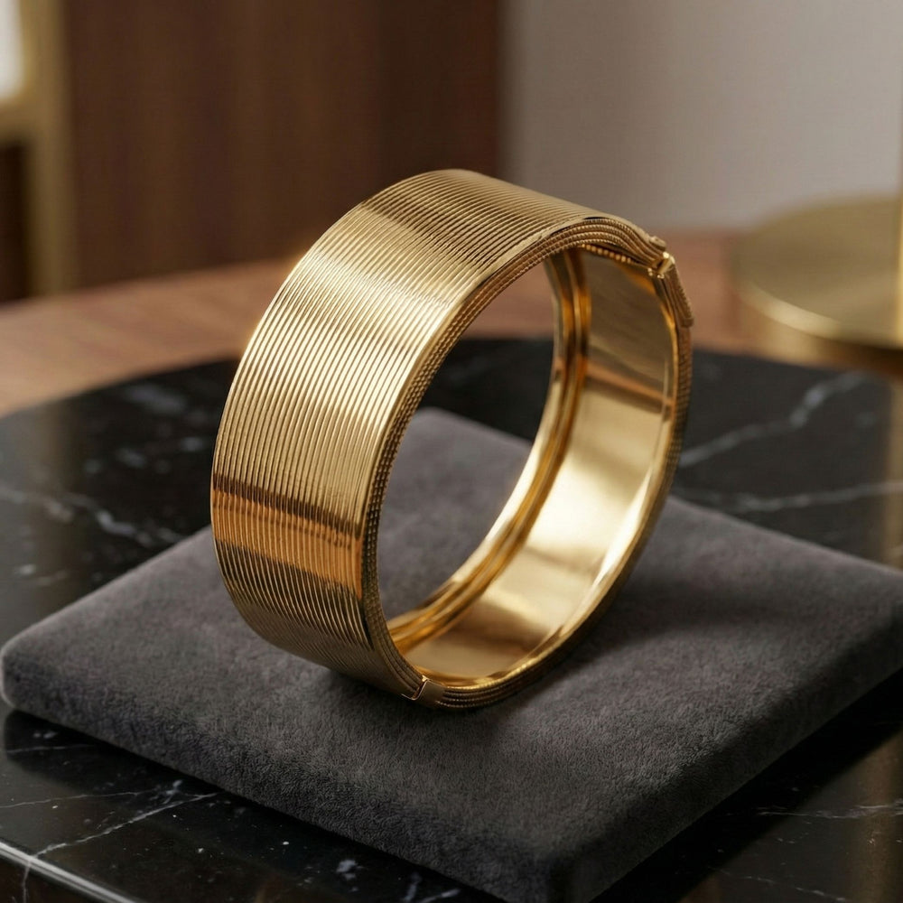 Elegant gold cuff bracelet by Sajna Sawarnaa featuring a bold statement design and anti-tarnish finish.