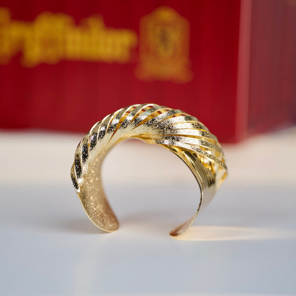 Gold twisted cuff bracelet for women by Sajna Sawarnaa, textured luxury statement bangle with anti-tarnish finish.