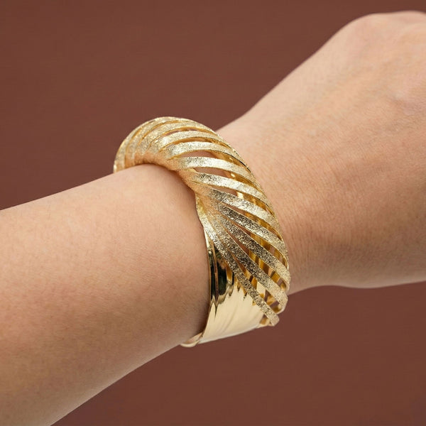 Sajna Sawarnaa women's twisted gold cuff bracelet with textured finish, luxury statement bangle, anti-tarnish jewelry.
