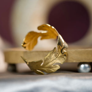 Women’s gold cuff bracelet with leaf pattern and open design, inspired by nature, from Sajna Sawarnaa.
