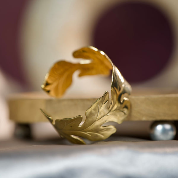 Women’s gold cuff bracelet with leaf pattern and open design, inspired by nature, from Sajna Sawarnaa.
