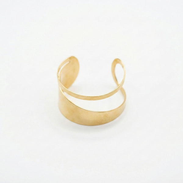 Elegant modern gold cuff bracelet for women with a double layer design, showcasing everyday luxury jewelry by Sajna Sawarnaa.