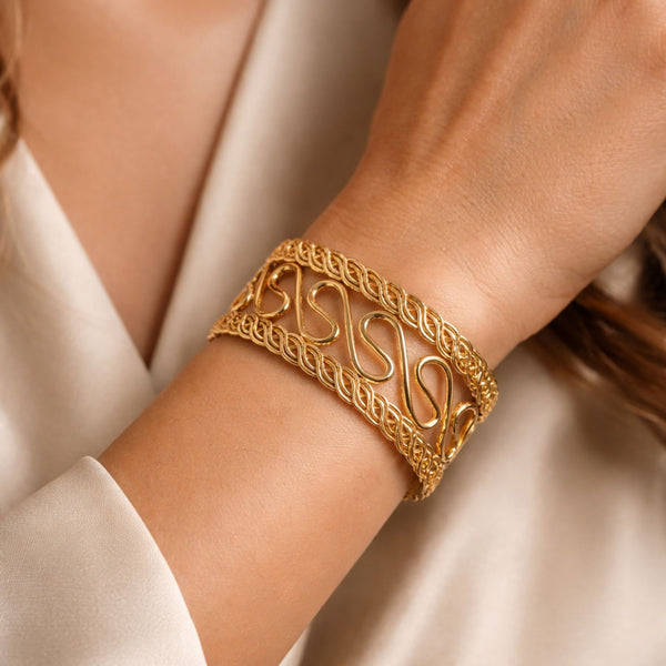 Elegant gold cuff bracelet for women with handcrafted design, perfect for party wear by Sajna Sawarnaa.