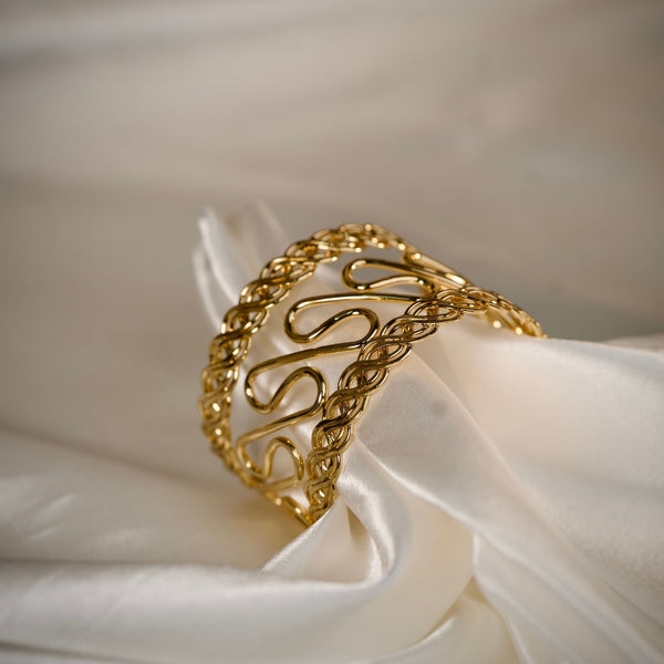 Elegant gold cuff bracelet for women featuring a handcrafted design, perfect for party wear by Sajna Sawarnaa.