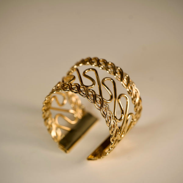 Women’s gold cuff bracelet with elegant handcrafted design by Sajna Sawarnaa, perfect for stylish party wear.