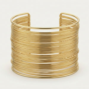 Gold layered cuff bracelet for women, Sajna Sawarnaa, featuring multiple thin bangles in a minimal, elegant design for daily wear.