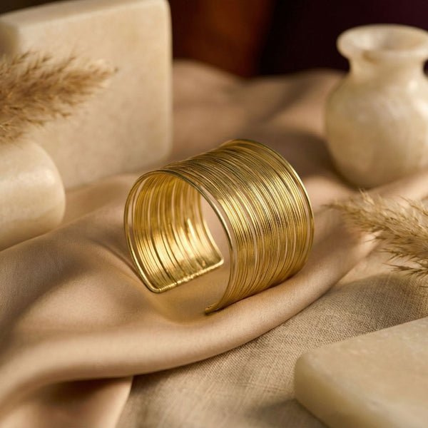 Elegant gold layered cuff bracelet for women, multi-line stack bangle jewelry by Sajna Sawarnaa, perfect for daily wear.