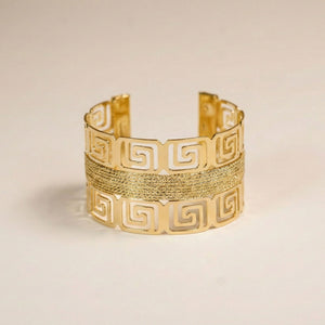 Royal gold statement cuff bracelet for women with Greek pattern, wide kada design, perfect for elegant party wear.