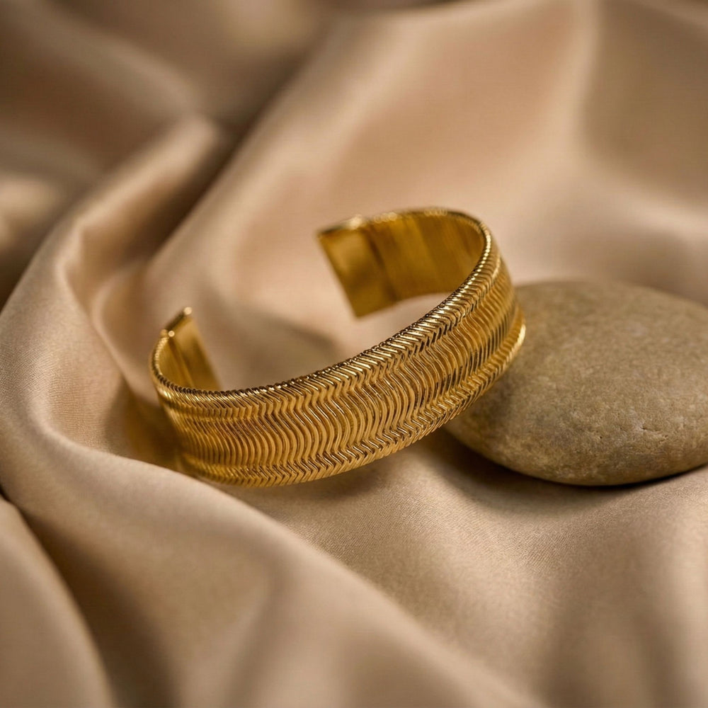 Women's gold wide cuff bracelet by Sajna Sawarnaa with textured design, perfect for everyday elegance and stylish accessories.