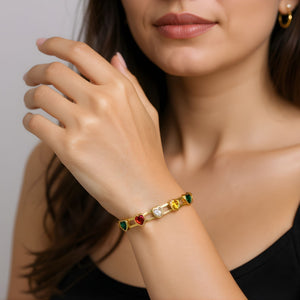 Multicolor gemstone gold bracelet for women, elegant Sajna Sawarnaa bangle featuring a heart-shaped gemstone design.