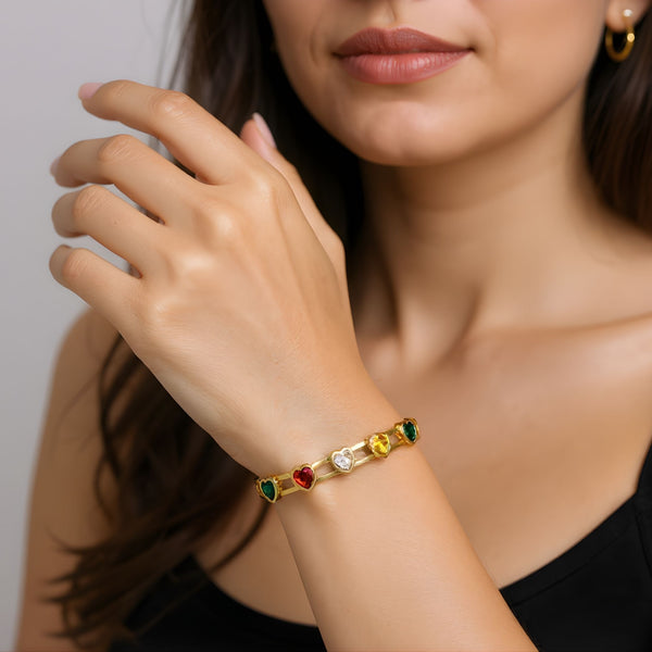 Multicolor gemstone gold bracelet for women, elegant Sajna Sawarnaa bangle featuring a heart-shaped gemstone design.