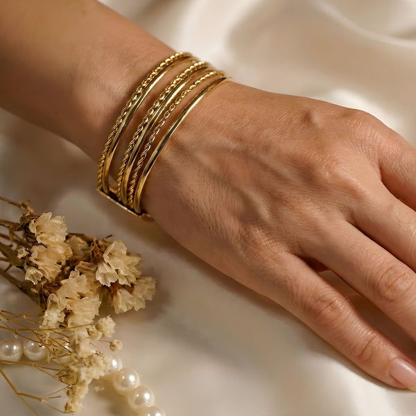 Gold layered cuff bracelet for women, SAJNA SAWARNAA designer multi-line open kada with intricate details and a stylish open design.