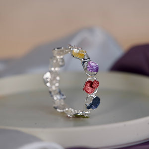 Colorful stone designer women's bracelet by Sajna Sawarnaa featuring an artistic multi-color open cuff design.