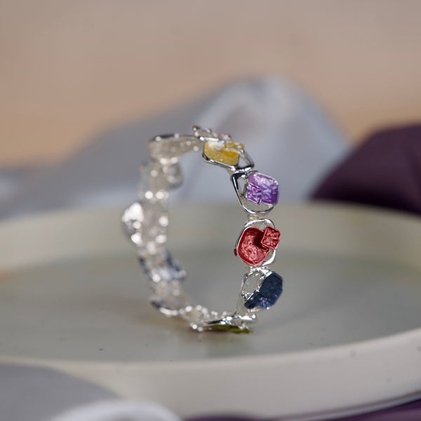 Colorful stone designer women's bracelet by Sajna Sawarnaa featuring an artistic multi-color open cuff design.