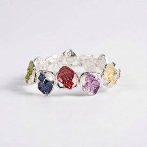 Colorful stone designer women's bracelet by Sajna Sawarnaa featuring an open cuff with vibrant multi-color stones.