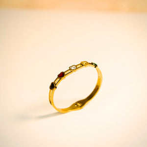 Elegant women's gold bracelet with multicolor heart-shaped gemstones, featuring a luxurious design by Sajna Sawarnaa.