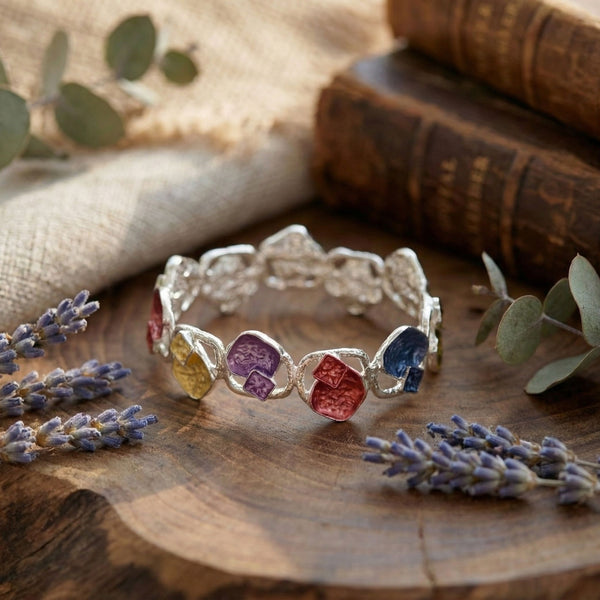 Colorful stone designer bracelet for women by Sajna Sawarnaa, featuring an artistic multi-color open cuff design.