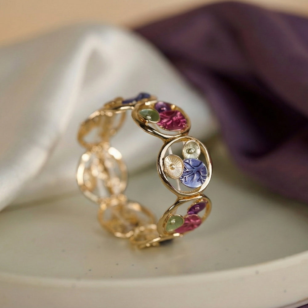 Gold floral enamel circle bracelet by SAJNA SAWARNAA, featuring Korean anti-tarnish jewelry design with intricate floral details.