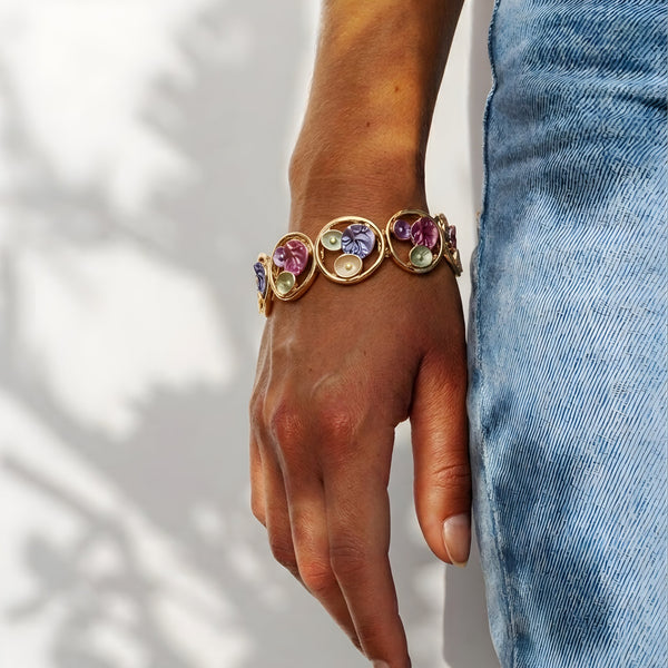 Gold floral enamel circle bracelet by SAJNA SAWARNAA featuring Korean anti-tarnish jewelry design and intricate floral details.