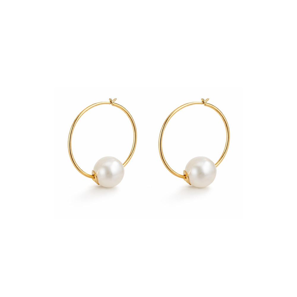 Gold hoop earrings with pearl beads on a white background