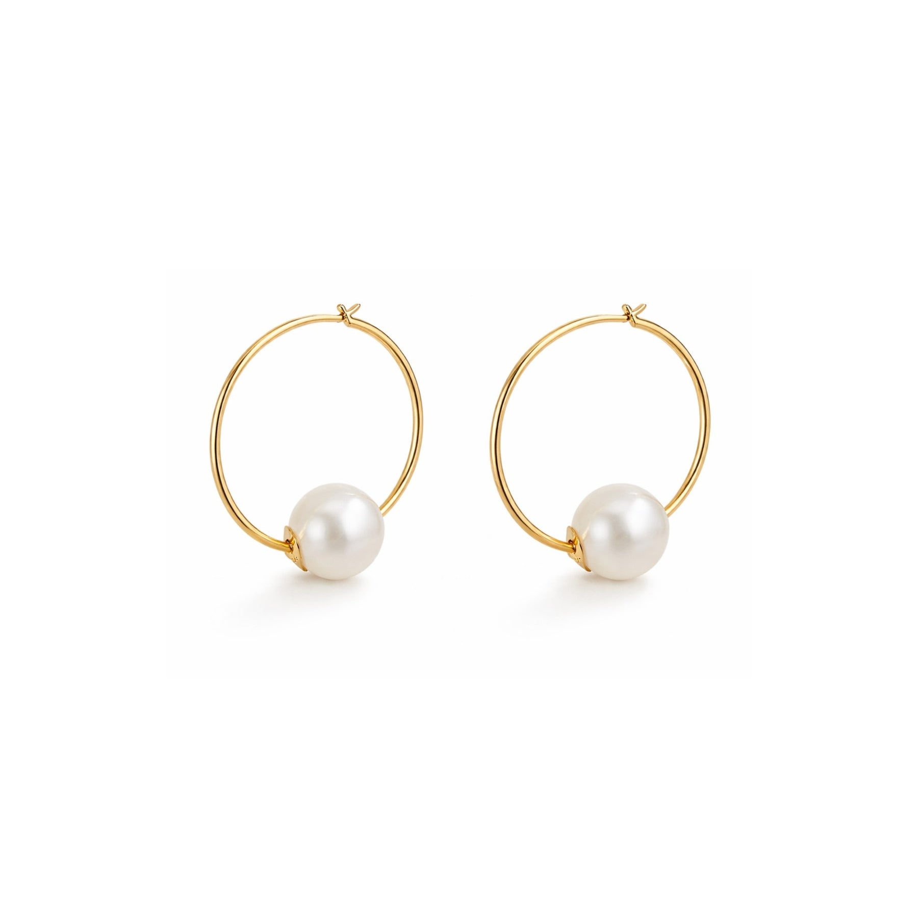 Gold hoop earrings with pearl beads on a white background