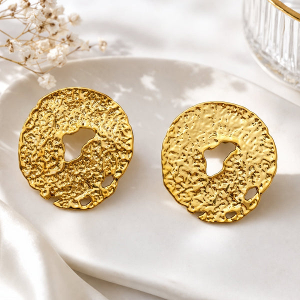 Hammered molten gold disc stud earrings for women by Sajna Sawarnaa, featuring organic textured round design and anti-tarnish finish.