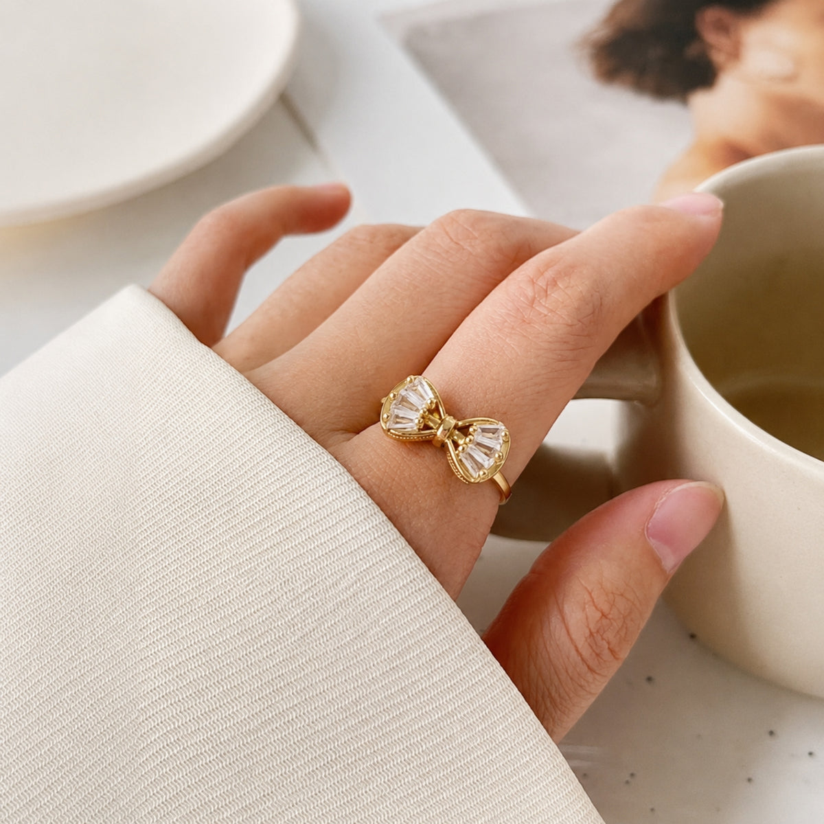 Crystal bow gold statement ring - worn lifestyle view