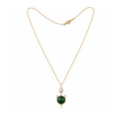 Gold-tone green cat charm necklace on a white background