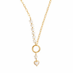 Gold-tone pearl-look heart drop necklace on a white background