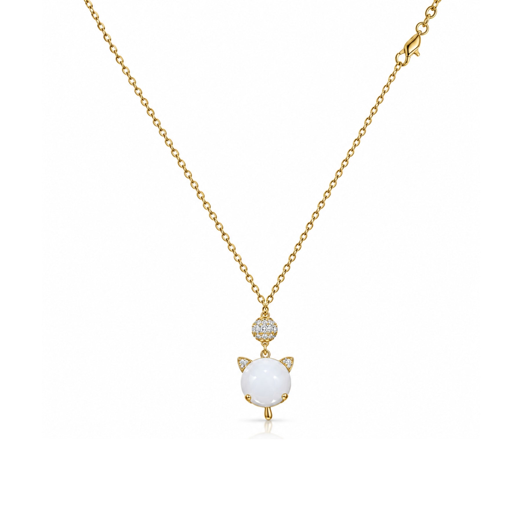 Gold-tone white cat charm pendant necklace with clear stone accents on a white background
