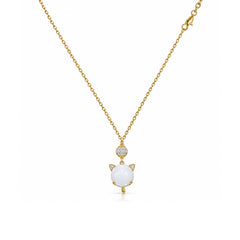 Gold-tone white cat charm pendant necklace with clear stone accents on a white background
