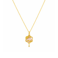Gold-tone pink floral charm pendant necklace on a white background