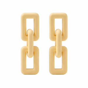 Woman wearing ivory geometric link statement earrings with modern matte finish and Korean-inspired minimal luxury design